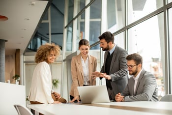 Team meeting in an office to discuss the attendee experience