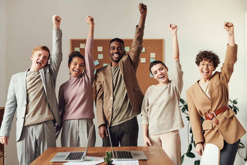 happy successful team in a meeting room
