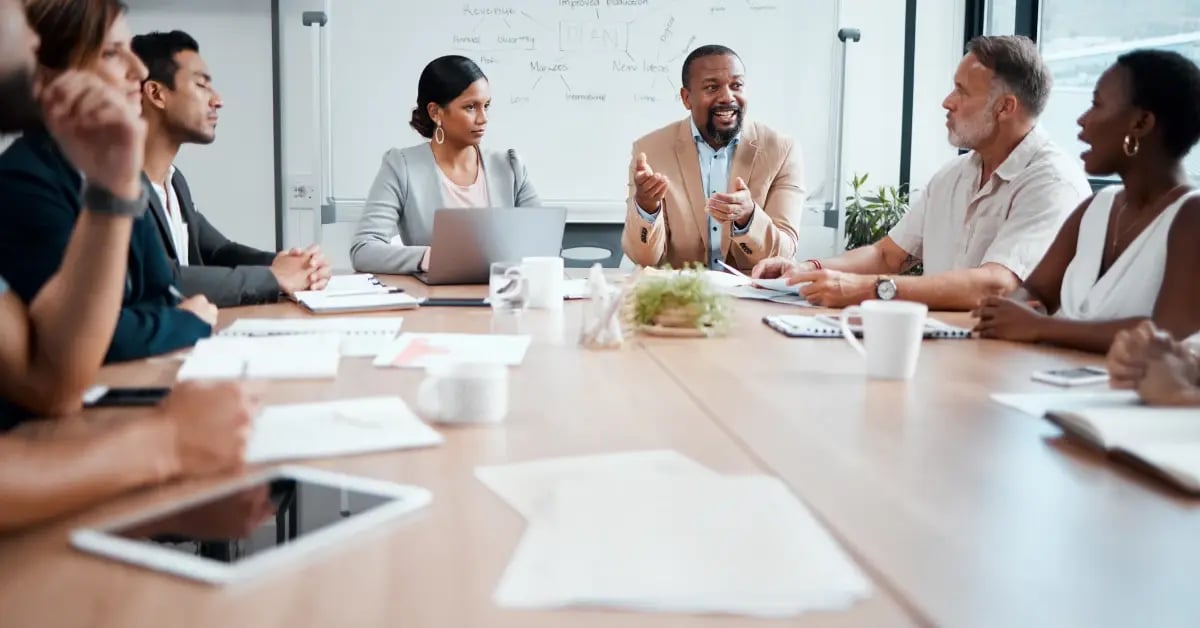 Team talking strategy in a one-day in-person meeting session